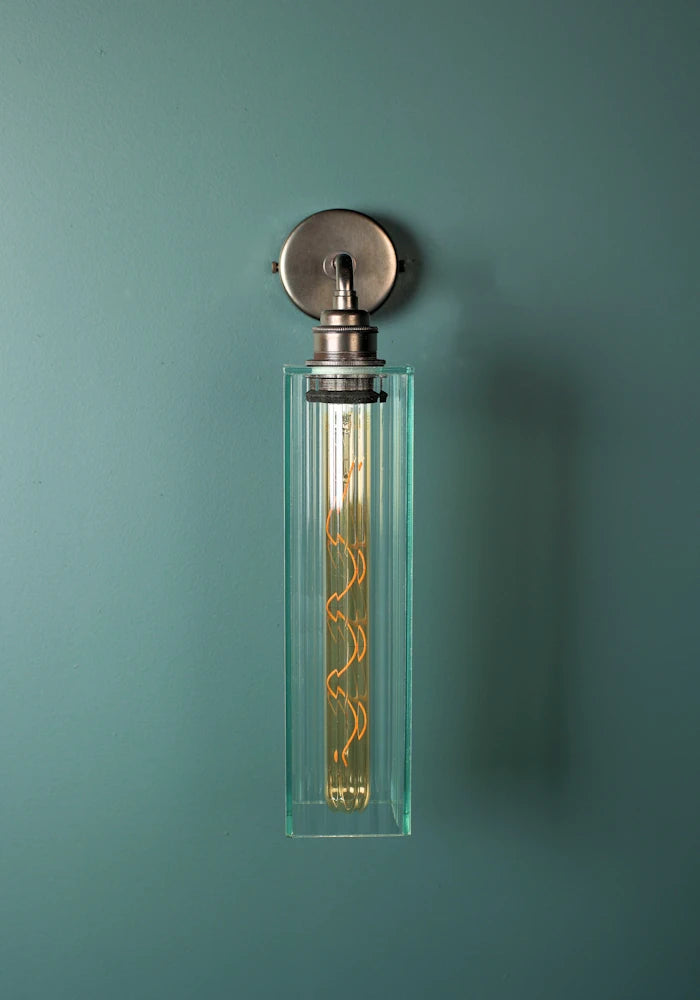 Elegant long fluted glass IP44 bathroom wall light with bronze fixtures
