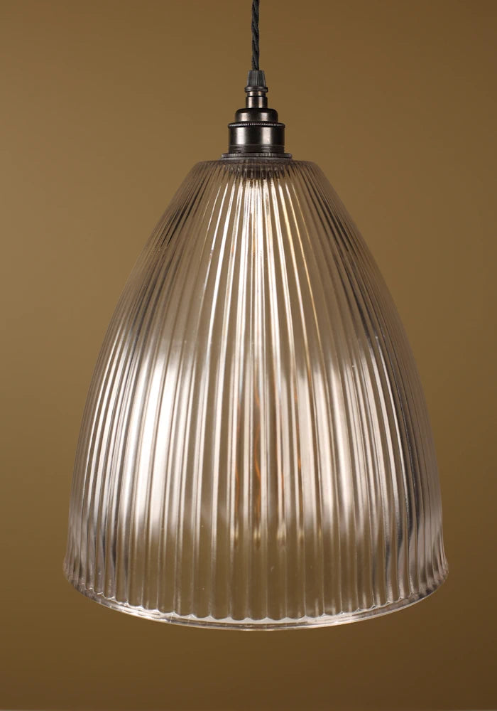 Large statement ribbed glass pendant light with bronze lamp holder, beige background