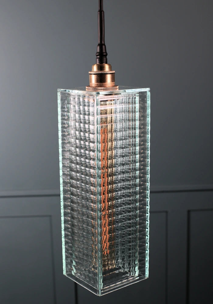 Large ribbed glass bathroom pendant light with brass lamp holder and black fabric flex