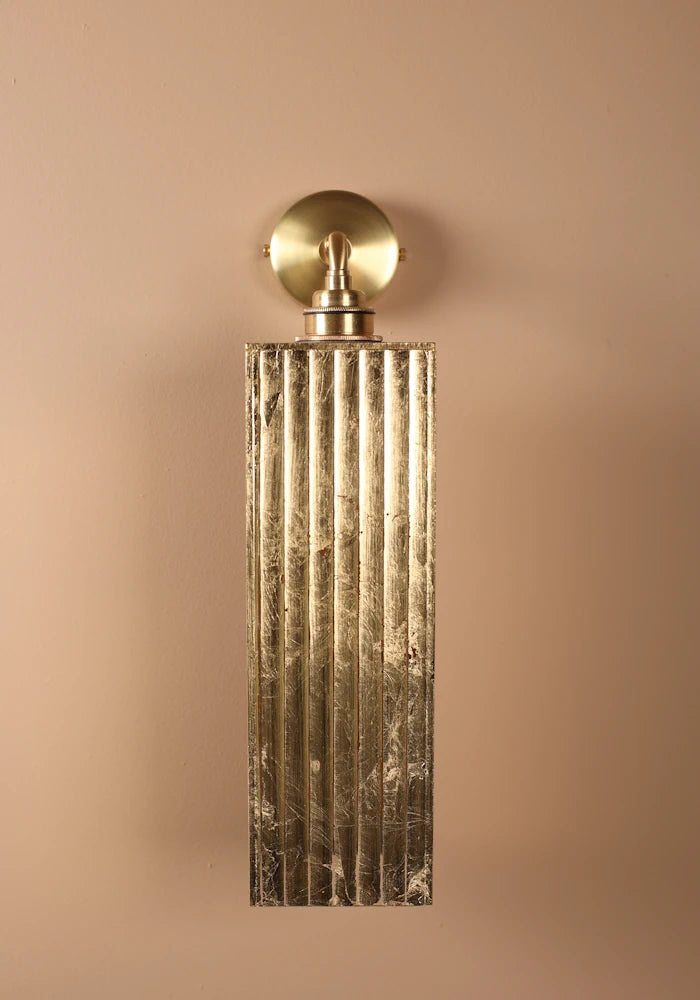 Elegant large ribbed glass ip44 gold leaf bathroom wall light close up with brass wall plate