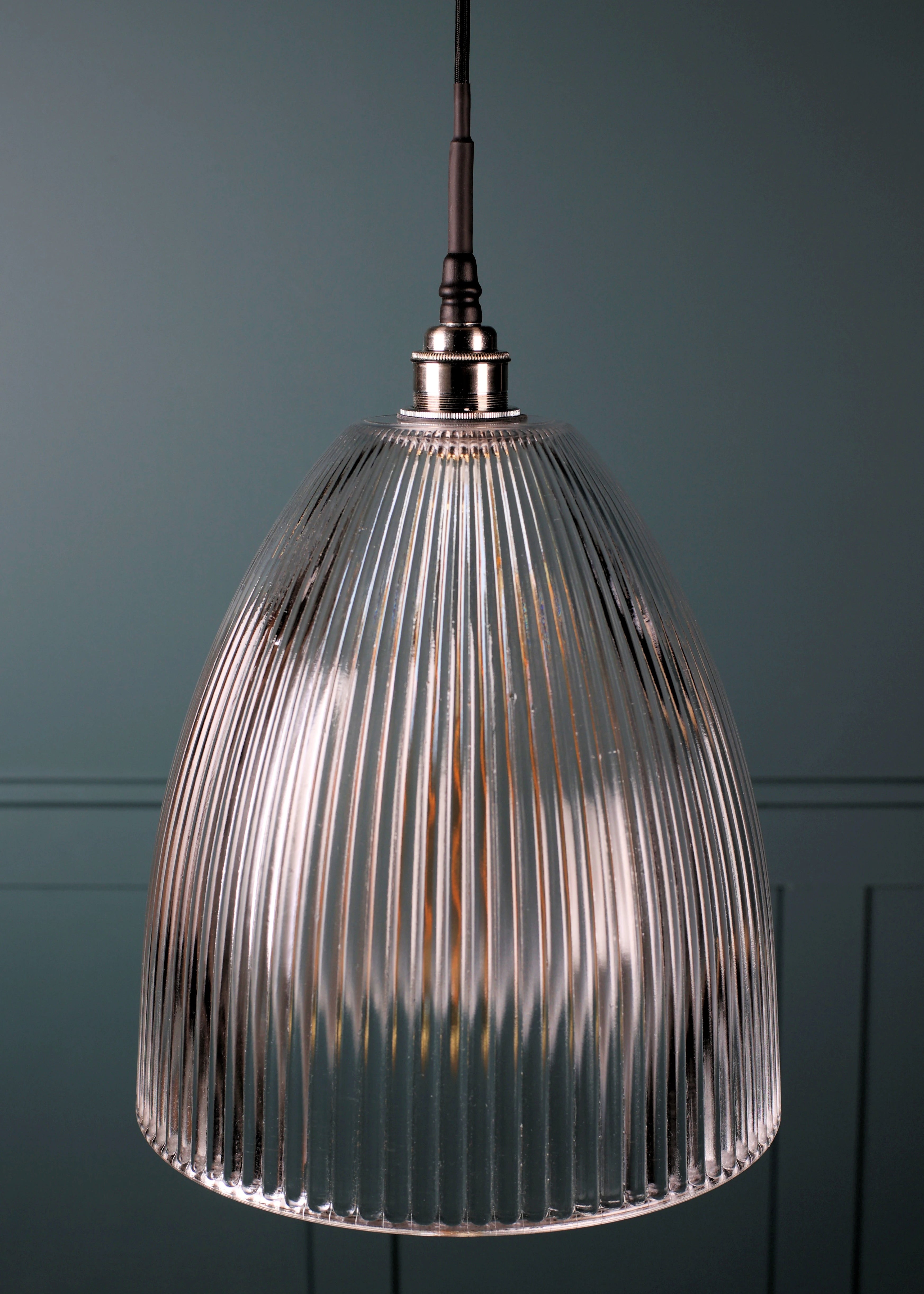 Large domed glass bathroom pendant light with nickel lamp holder on teal coloured background