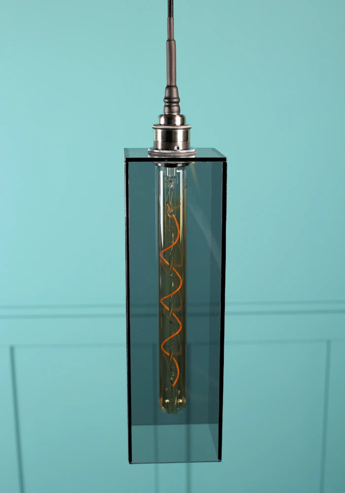 Elongated medium size rectangular smoked glass bathroom pendant light with brushed nickel lamp holder.