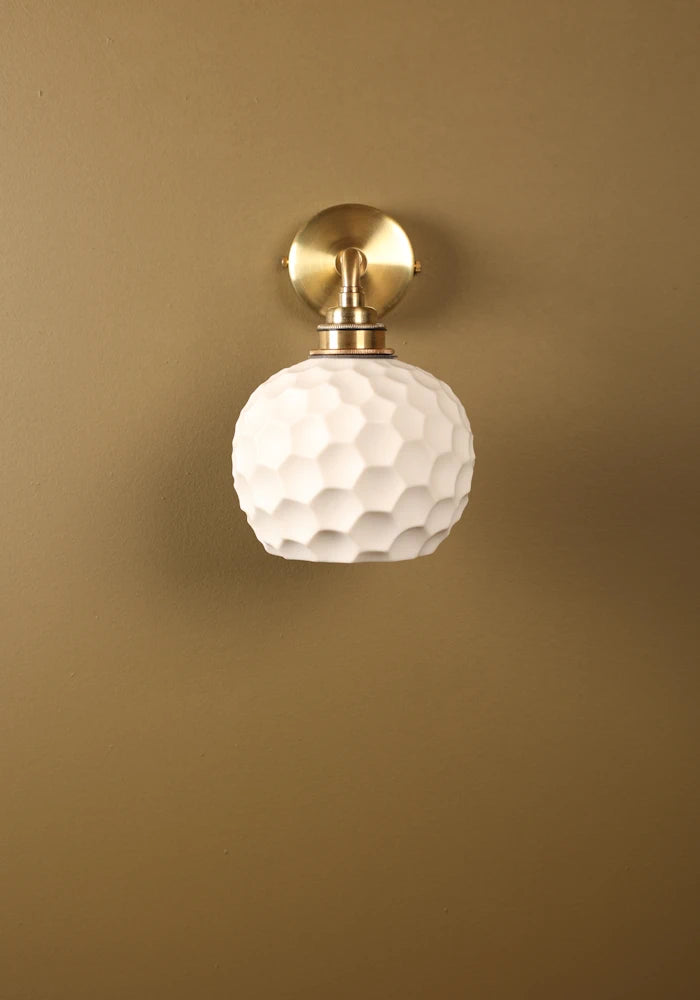 Elegant honeycomb effect ceramic IP44 bathroom wall light with brass fixtures