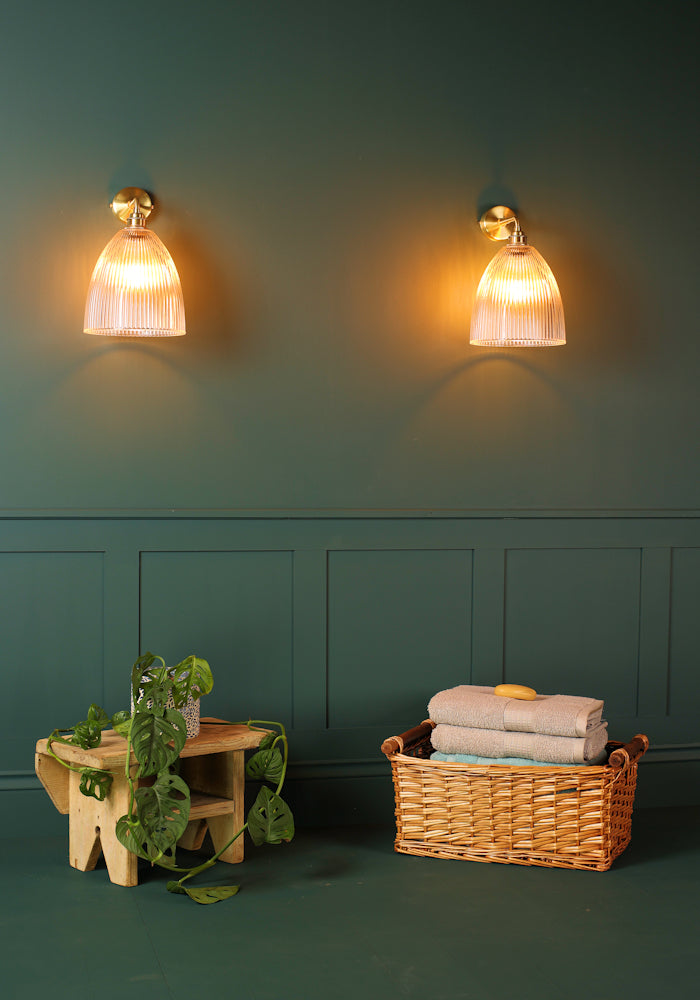 Elegant large bell glass IP44 bathroom wall lights, bath towels in basket, pot plant