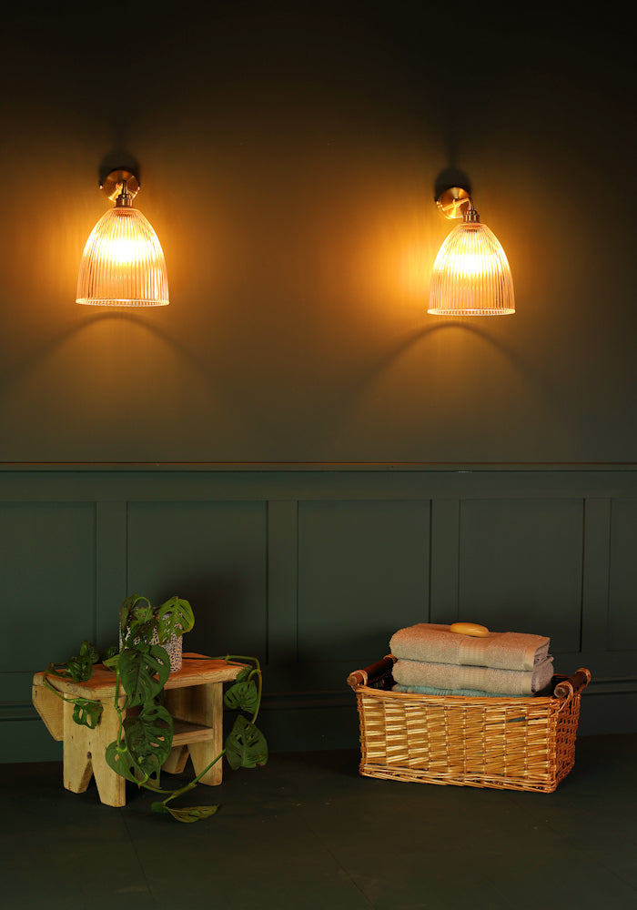 Elegant large bell glass IP44 bathroom wall lights, bath towels in basket, pot plant