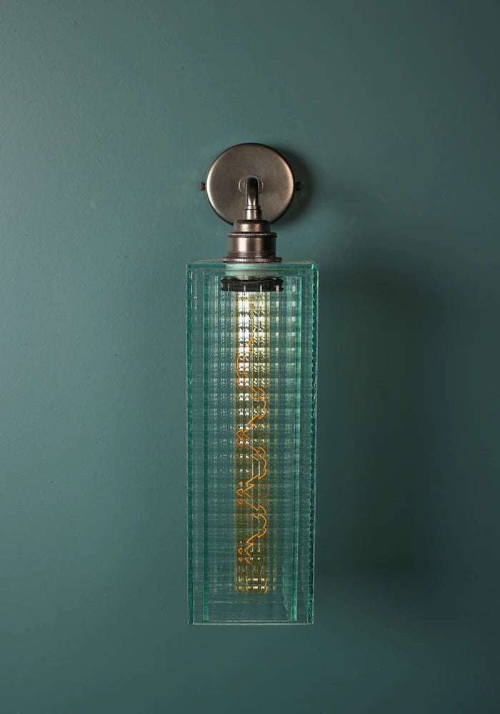 Elegant fluted art deco glass IP44 bathroom wall light with bronze fixtures