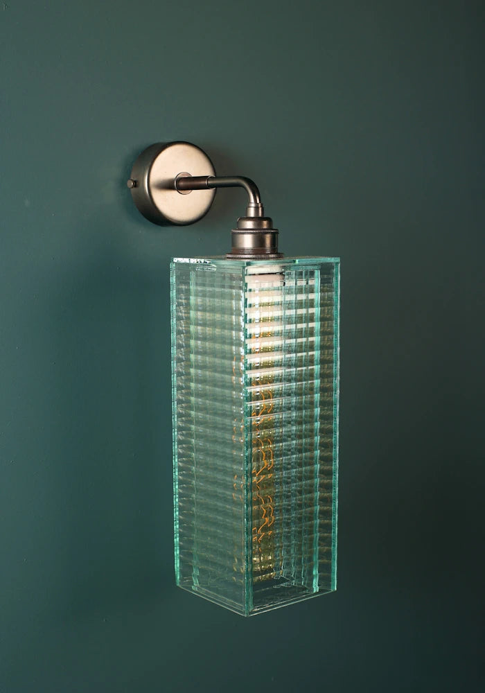 Elegant fluted art deco glass IP44 bathroom wall light with bronze fixtures