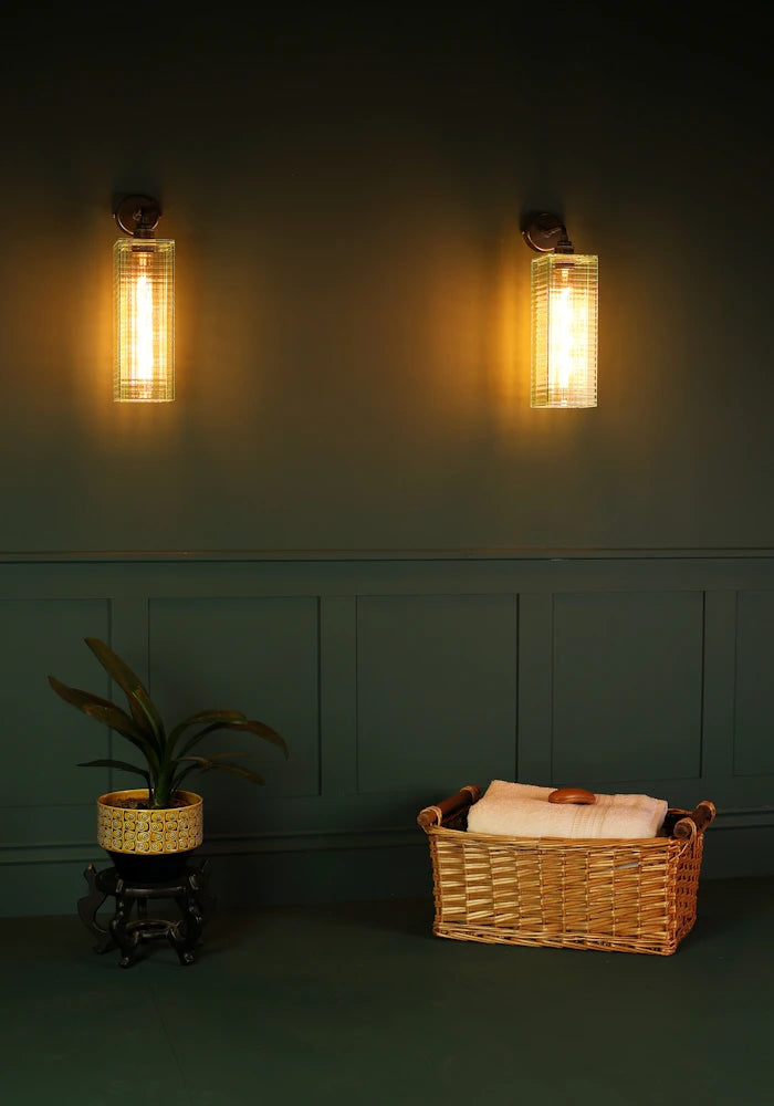 Elegant art deco glass IP44 bathroom wall lights, bath towels in basket, pot plant