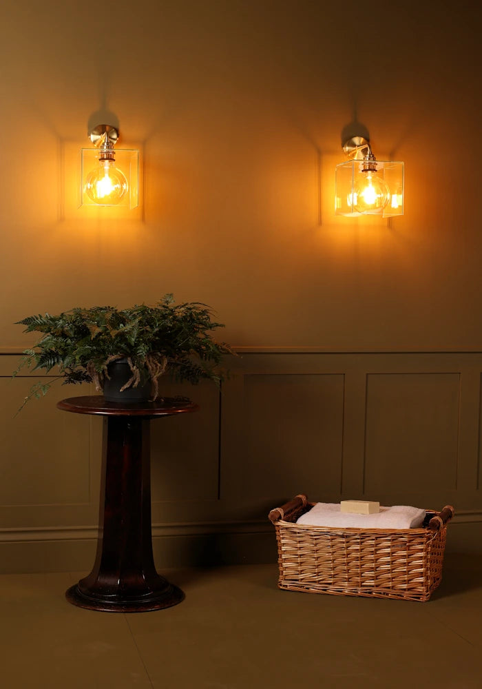 Elegant square glass IP44 bathroom wall lights with plant and bath towels 