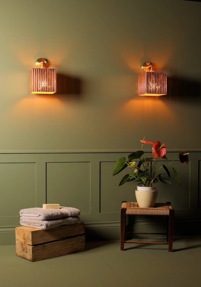 Elegant square copper IP44 bathroom wall lights, bath towels, exotic pot plant