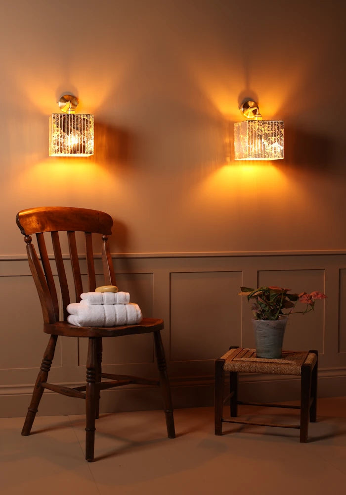Square gold leaf IP44 bathroom wall lights with wooden chair, bath towels and plant
