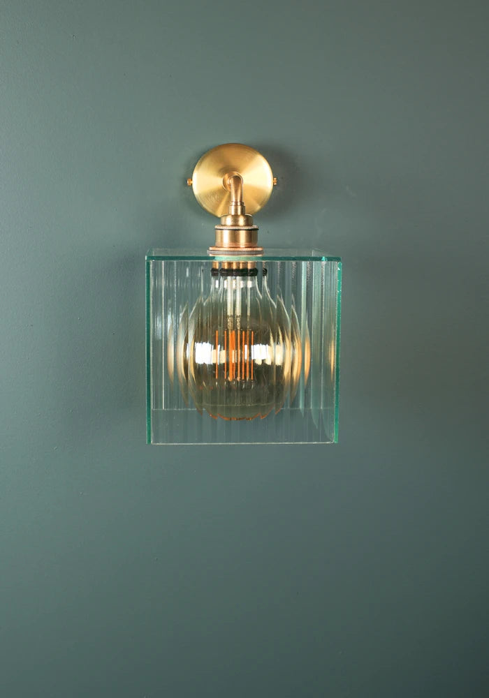 Elegant square ribbed glass IP44 bathroom wall light with brass fixture