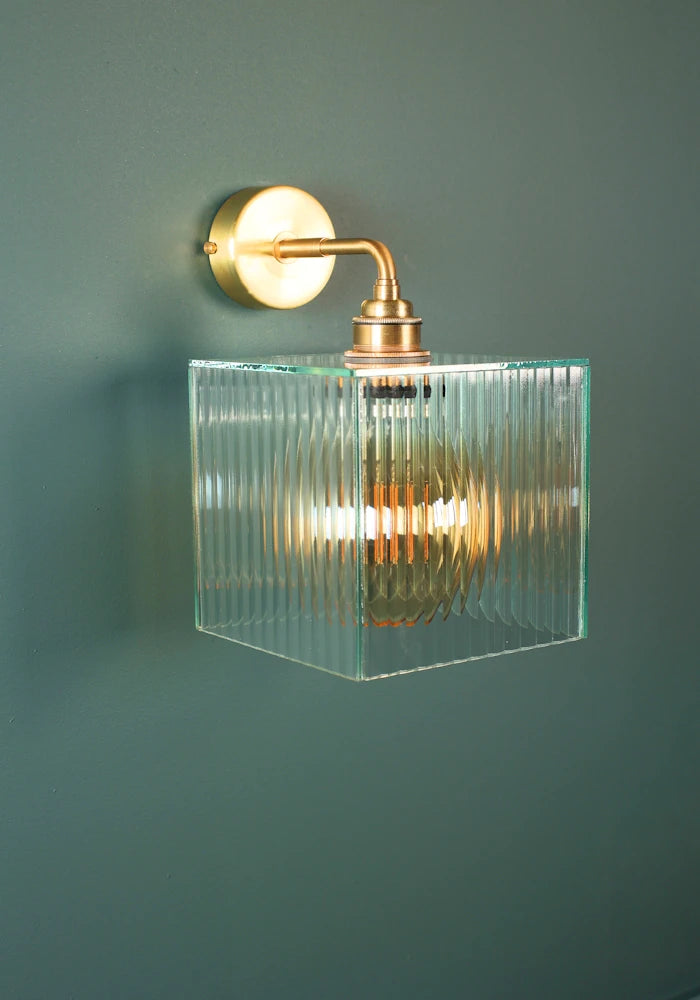 Elegant square ribbed glass IP44 bathroom wall light with brass fixture