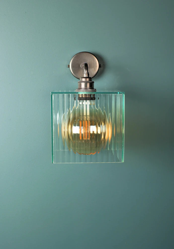 Elegant square ribbed glass IP44 bathroom wall light with bronze fixture