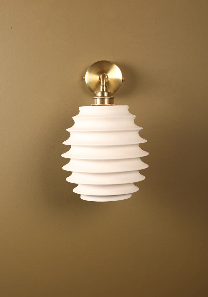 Elegant concertina style ceramic IP44 bathroom wall light with brass fixtures