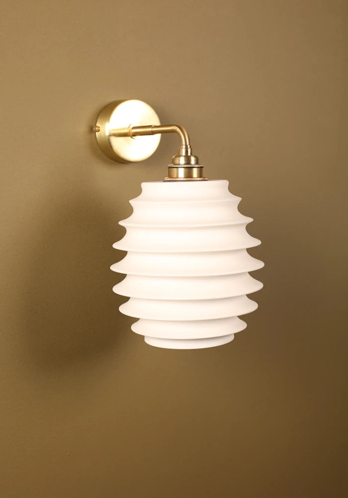 Elegant concertina style ceramic IP44 bathroom wall light with brass fixtures