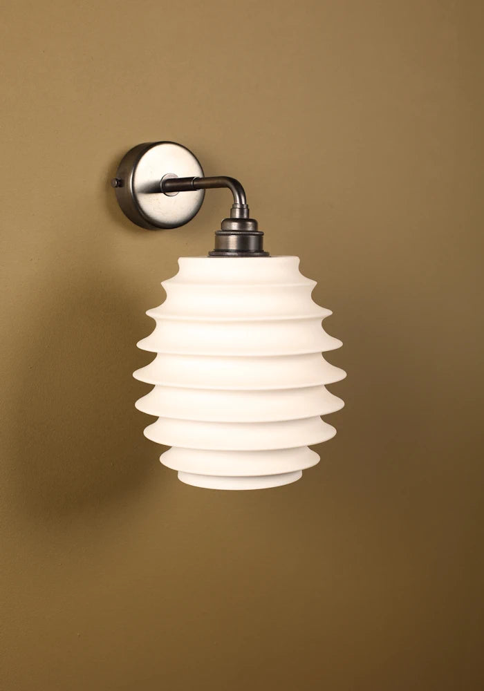 Elegant concertina style ceramic IP44 bathroom wall light with bronze fixtures