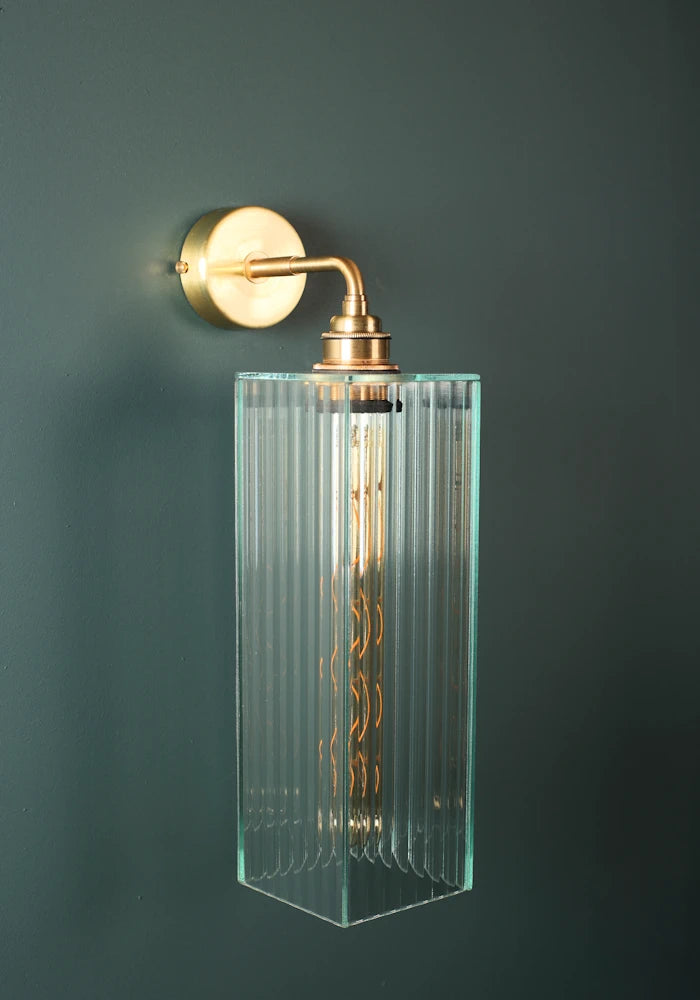 Elegant large ribbed glass ip44 bathroom wall light with brass fixture