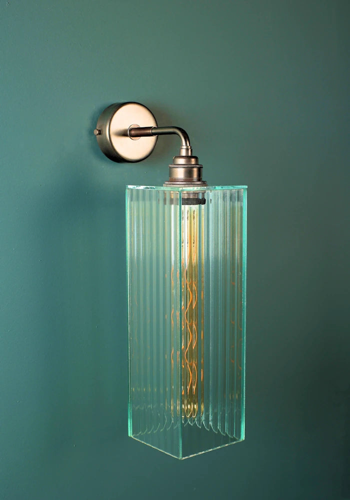 Elegant large ribbed glass ip44 bathroom wall light with bronze fixture
