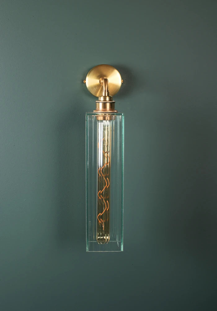 Elegant long fluted glass IP44 bathroom wall light with brass fixtures