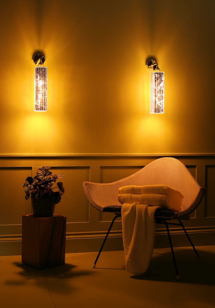 Elegant long silver IP44 bathroom wall lights, art deco chair, pot plant 