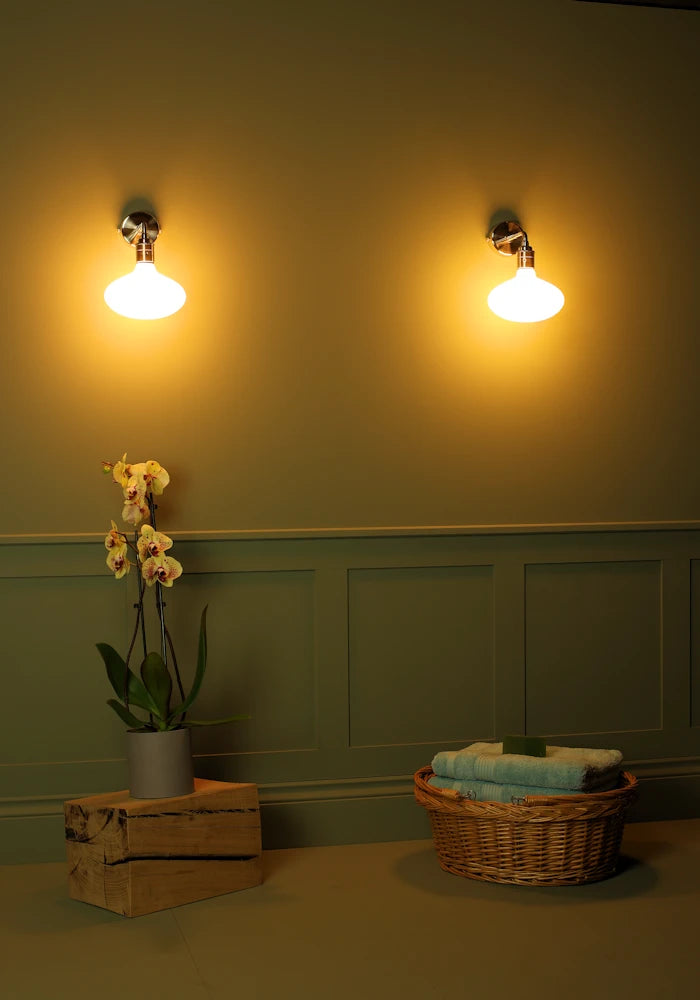 Elegant Tala Oval  IP44 bathroom wall lights, exotic plant, basket with bath towels