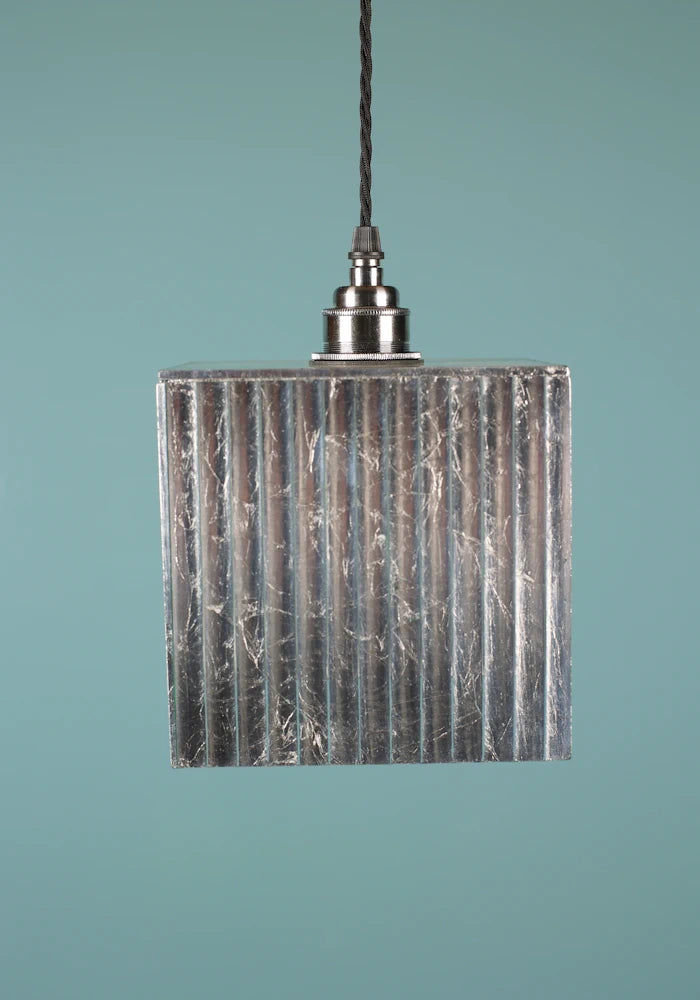 Cubed silver decorative pendant light with nickel lamp holder, blue background