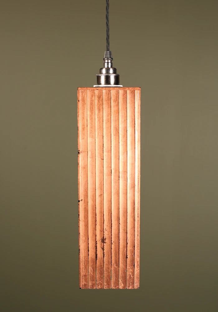 Copper leaf pendant light with nickel lamp holder on sage green background