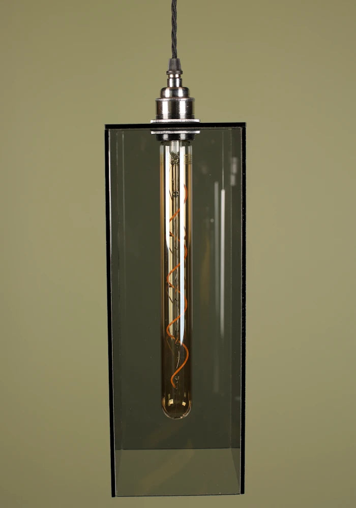 Pendant light with a smoked glass shade and nickel lamp holder on a plain background.