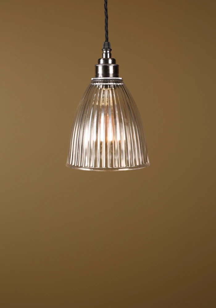 Small prismatic glass pendant light, nickel lamp holder on beige background