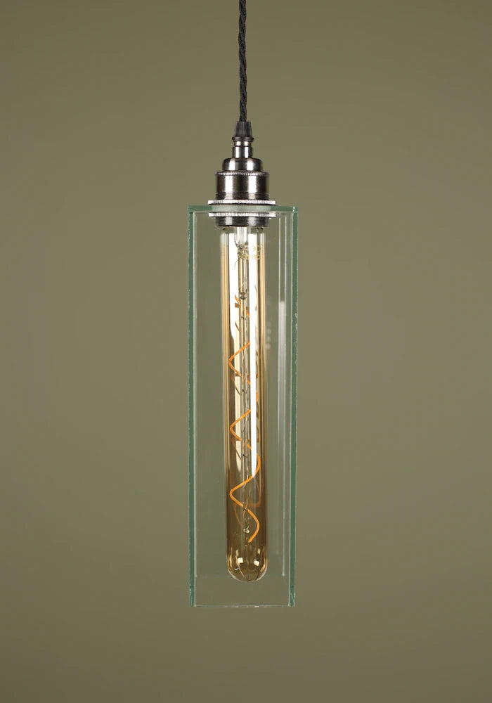 Elegant long clear glass pendant light with nickel lamp holder, sage green background