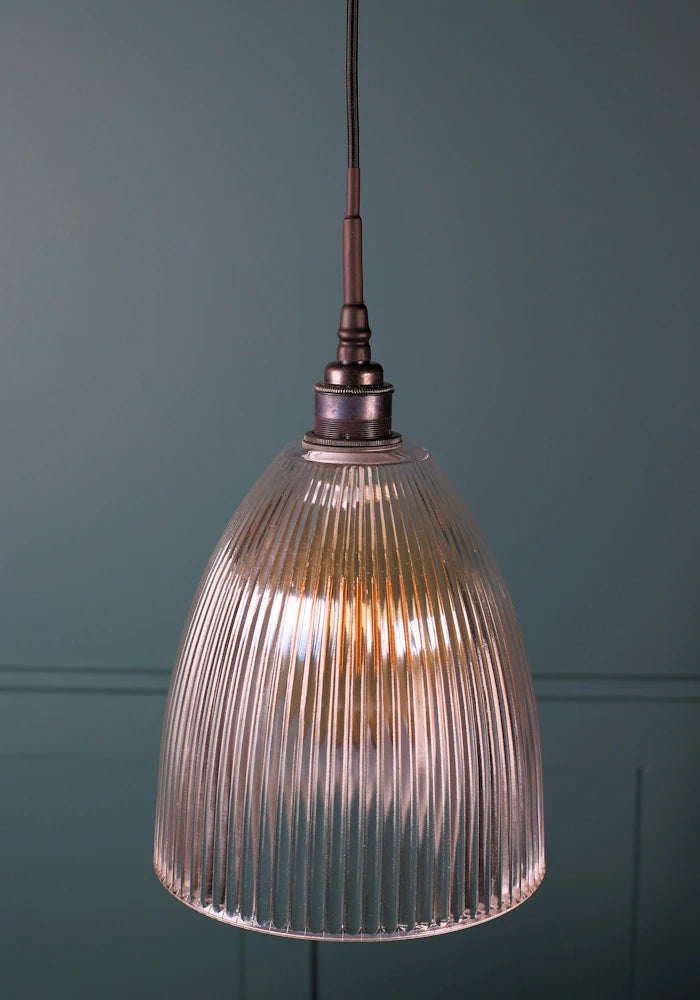 Medium sized ribbed glass bathroom pendant light with antique bronze lamp holder and black fabric flex