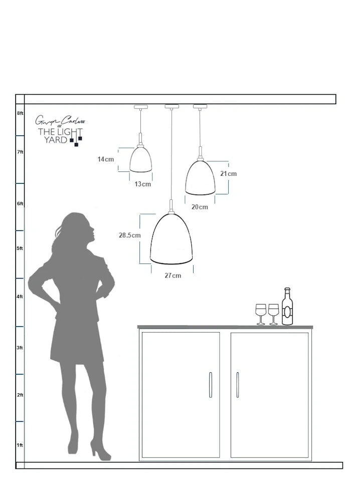 Diagram showing pendant lamp dimensions relative to a woman's silhouette and a cabinet.