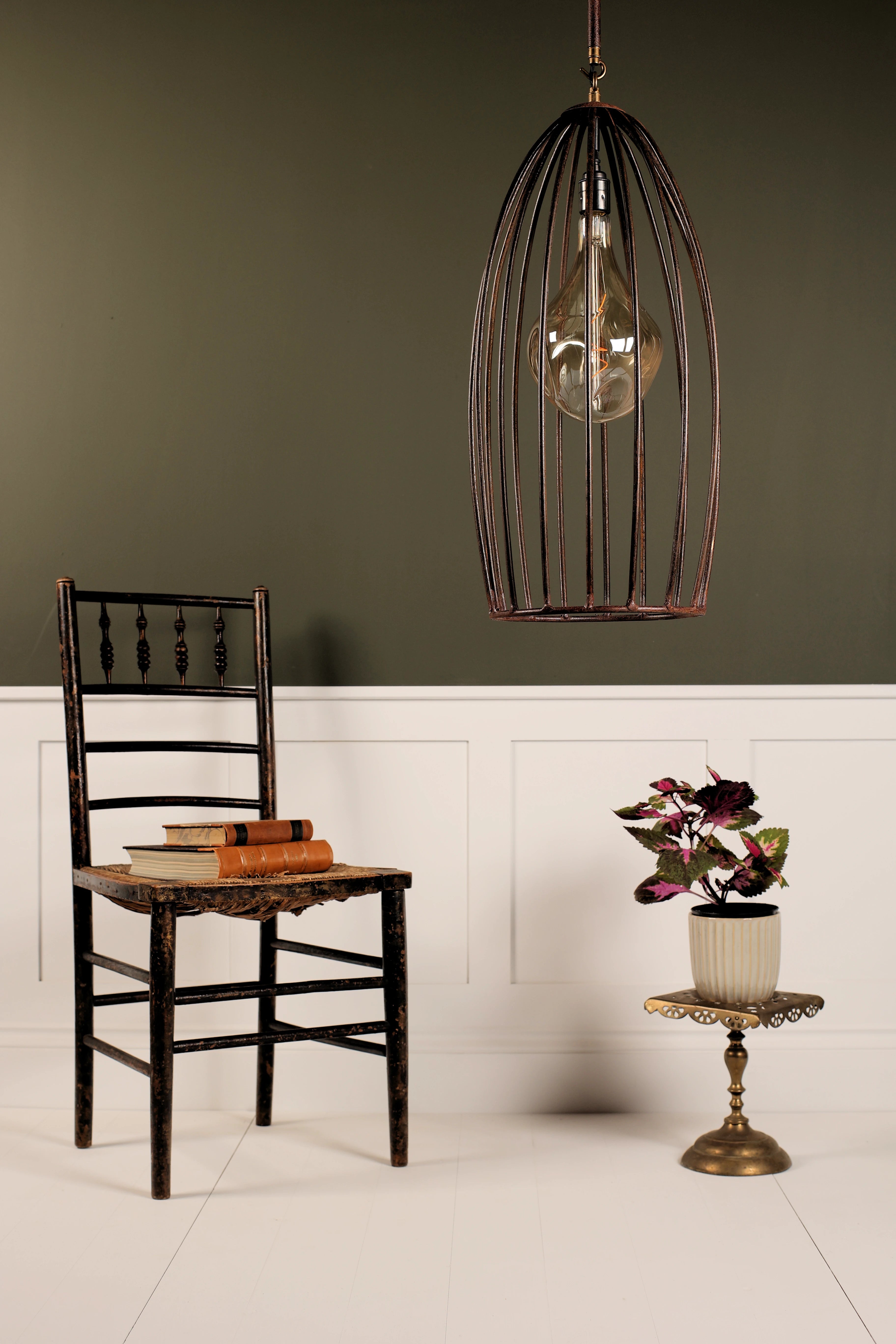 Vintage-style room with a wooden chair, small table, and decorative lamp.