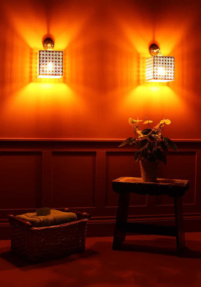 Elegant square Moroccan style gold IP44 bathroom wall lights, basket with bath towels, pot plant