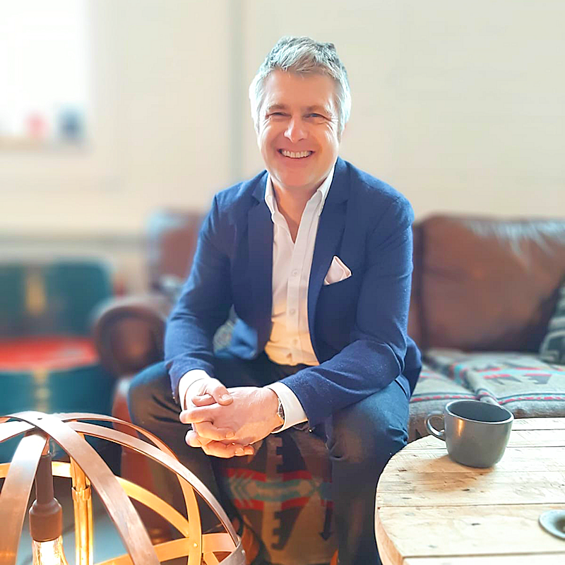 Jeff Fuller, director of The Light Yard wearing a blue jacket and smiling 