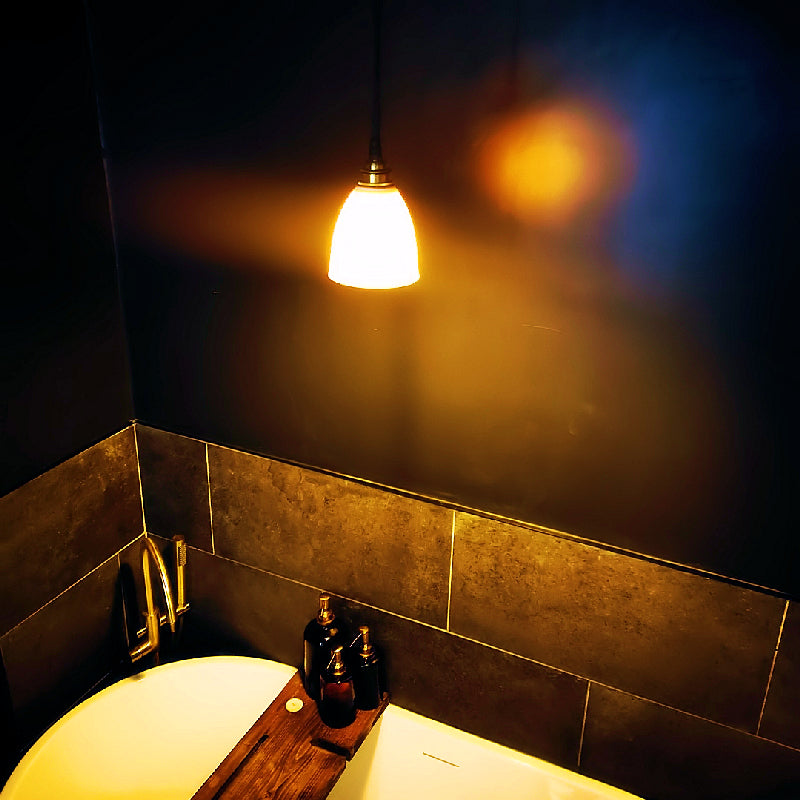 porcelain pendant light hanging in designer bathroom