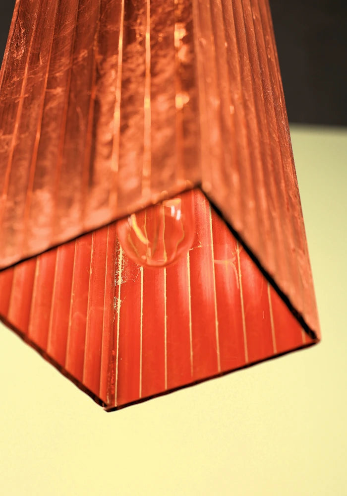 Close up of inside elongated copper leaf bathroom pendant light.