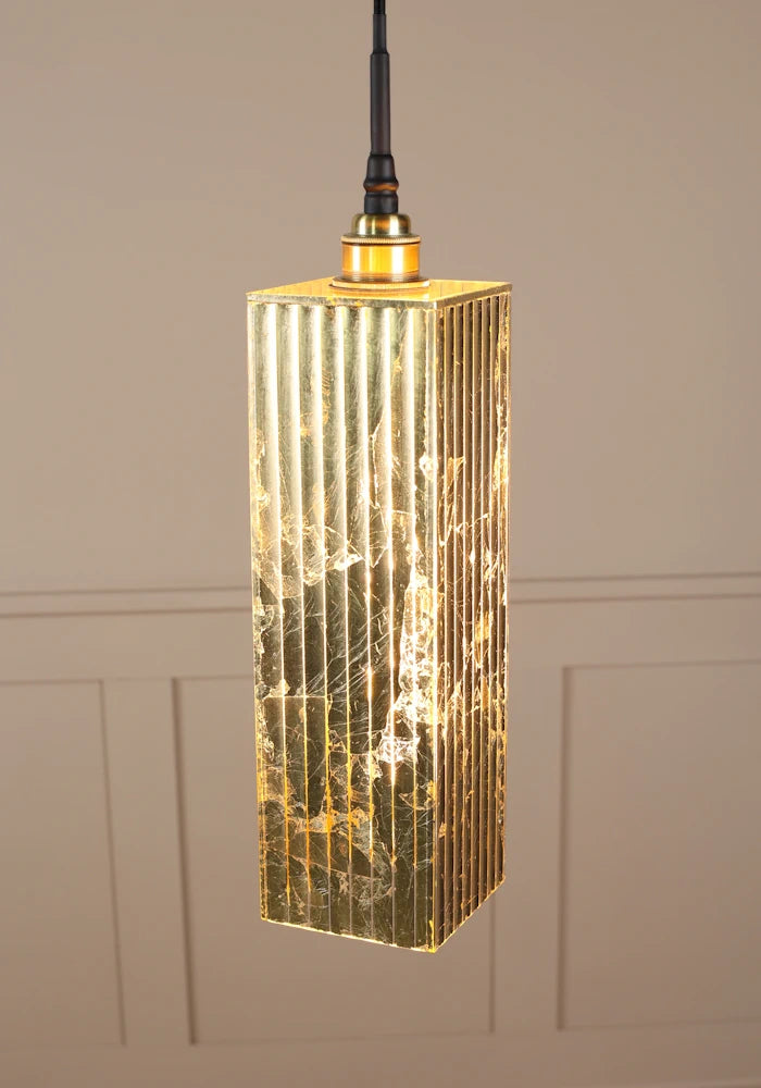 Long rectangular gold leaf bathroom pendant light with brushed brass lamp holder.