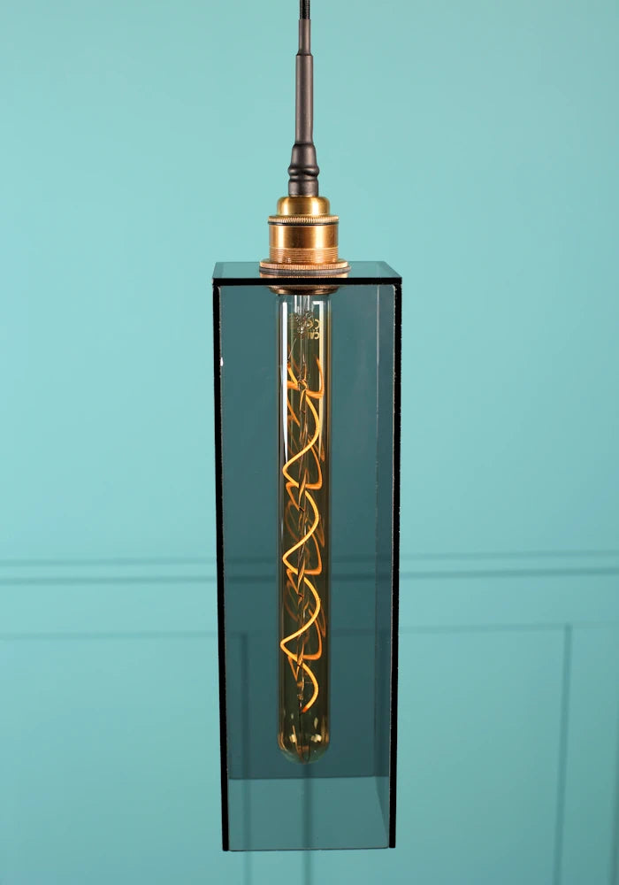 Elongated medium size rectangular smoked glass bathroom pendant light with brushed brass lamp holder. 