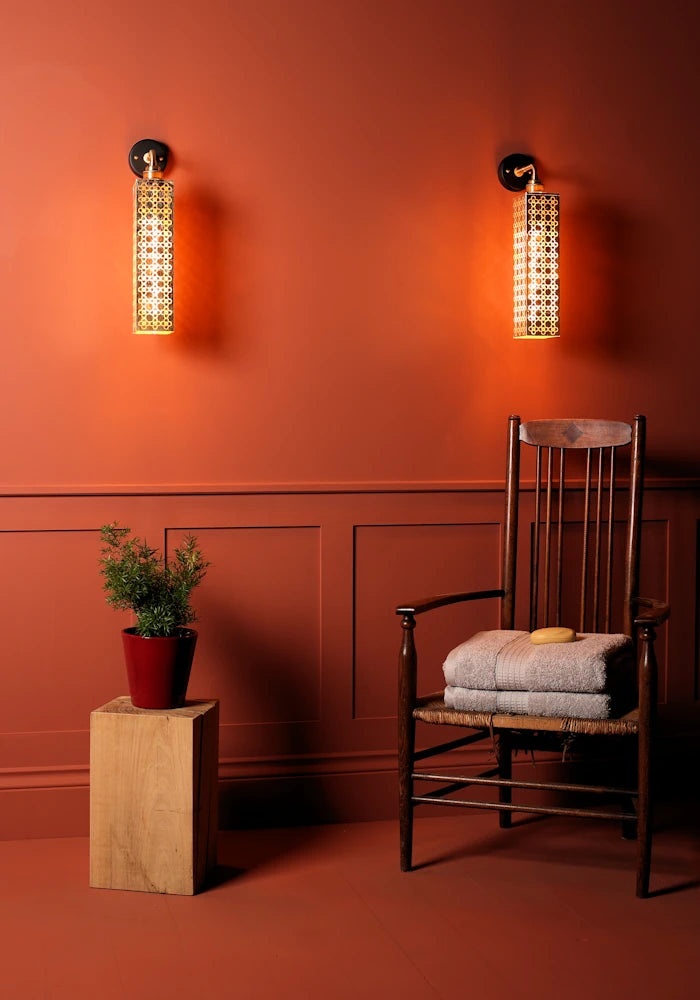 Elegant Moroccan style gold leaf IP44 bathroom wall lights, wooden chair with bath towels, plot plant