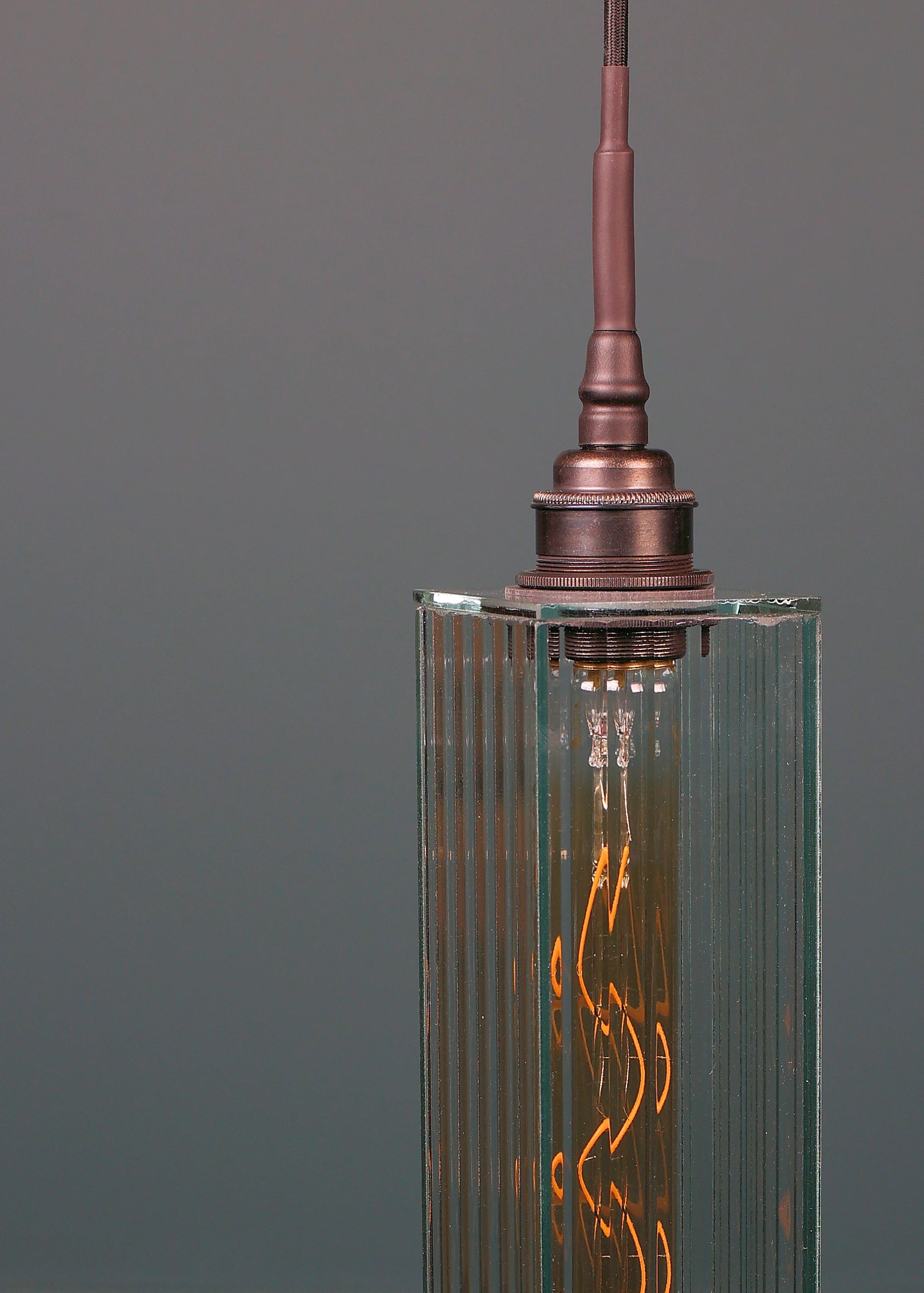 Long rectangular ribbed glass bathroom pendant light with antique bronze lamp holder