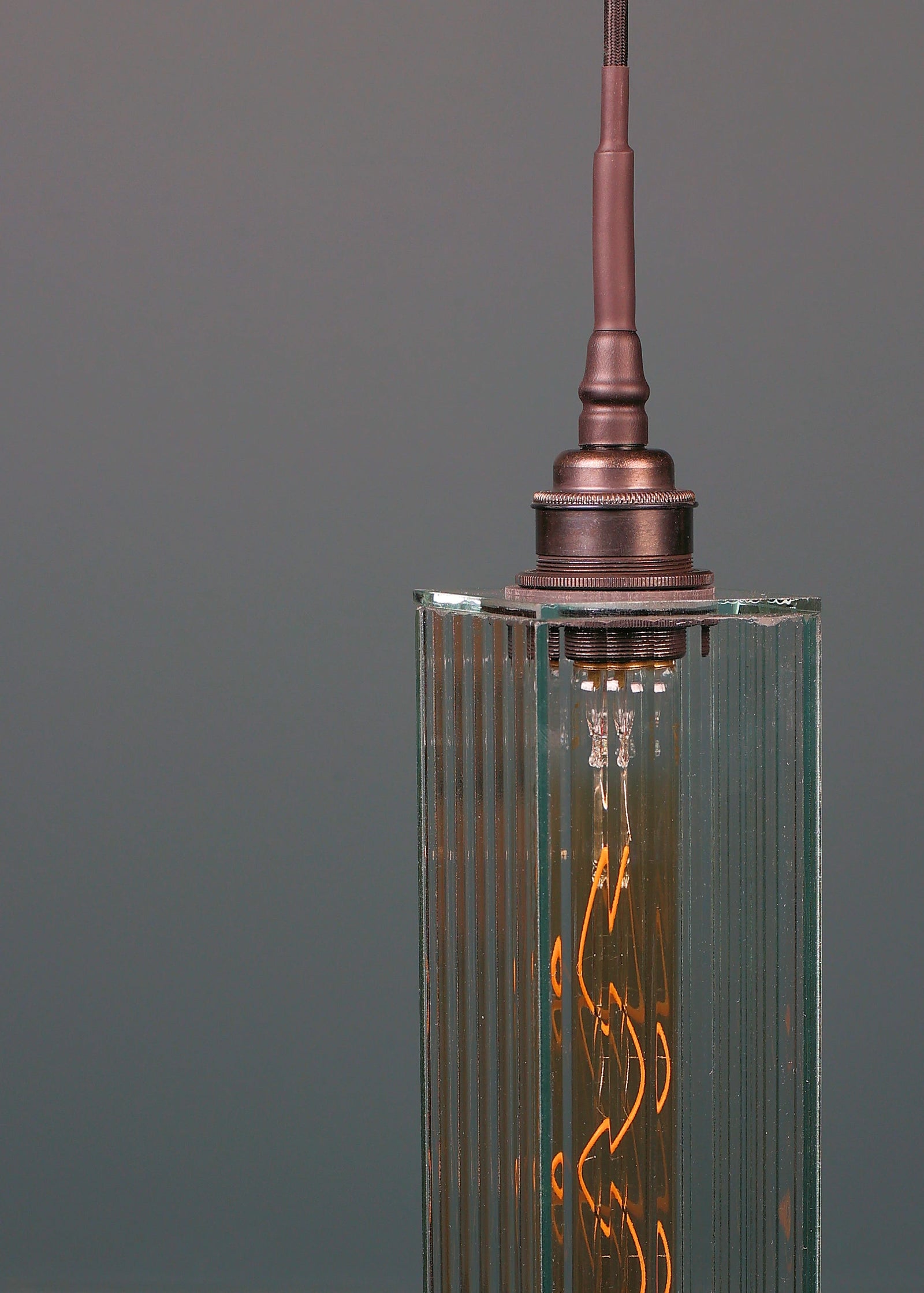 Long rectangular ribbed glass bathroom pendant light with antique bronze lamp holder