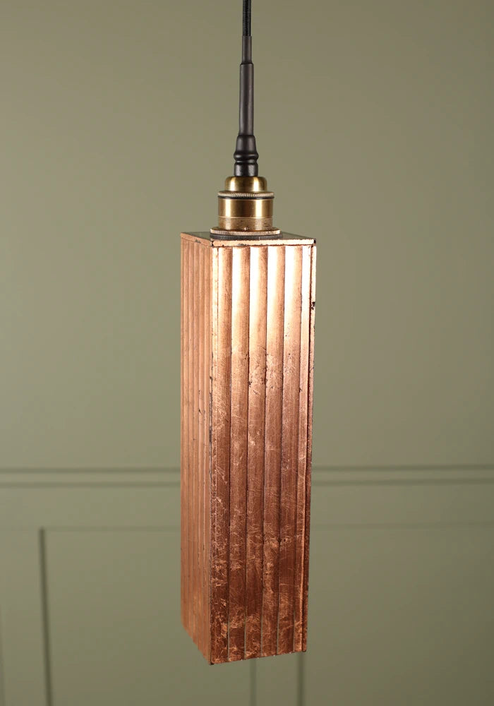 Long rectangular copper leaf bathroom pendant light with brushed brass lamp holder.